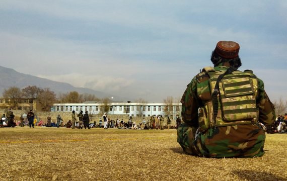 A Taliban security personnel keeps watch ahead of the court flogging of women and men at a football stadium in Charikar city of Parwan province on December 8, 2022. The Taliban flogged 27 Afghans, including women, in front of a large crowd December 8, a day after publicly executing a convicted murderer for the first time since they returned to power last year. (Photo by AFP) / TO GO WITH 'AFGHANISTAN-TALIBAN-CRIME'  - To go with 'Afghanistan-Taliban-Crime'